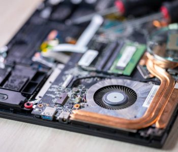Laptop Computer Being Repaired Computer repair service. Hardware support. Electronic technology.